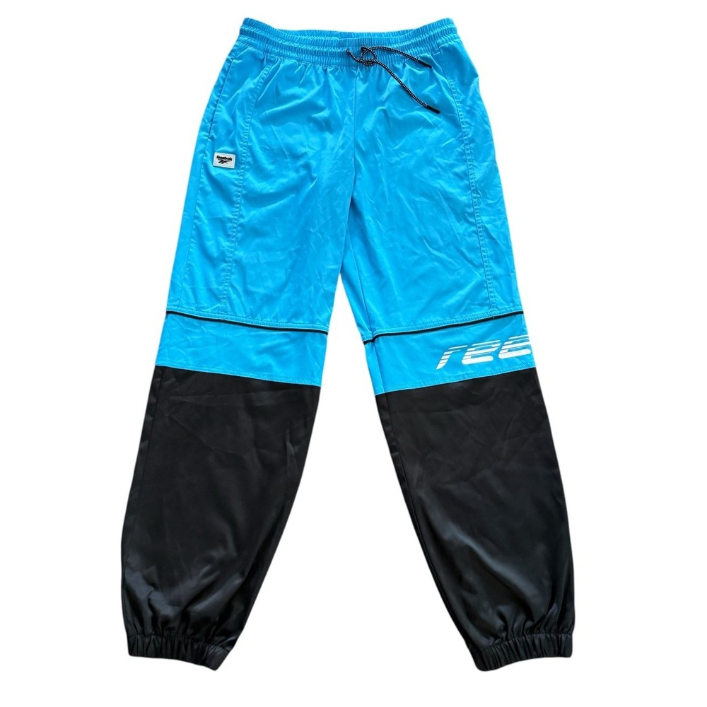 Reebok is wind pants unisex size Medium